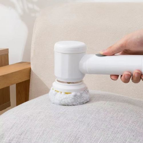 Handheld spin scrubber with interchangeable brush heads for bathroom kitchen and surface cleaning alternate depiction of use