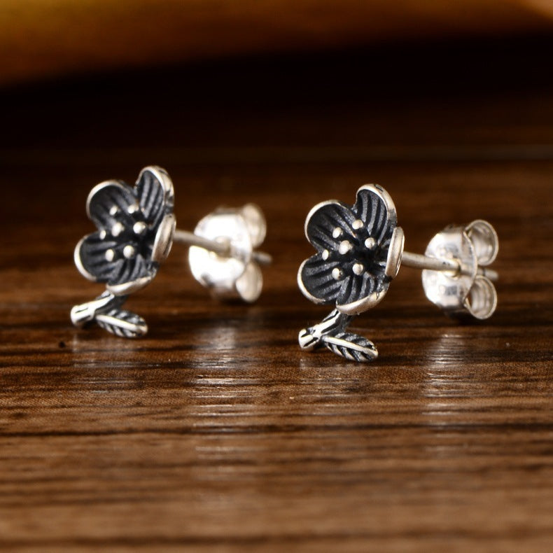 Lotus silver stud earrings with minimalist floral design for everyday wear side view
