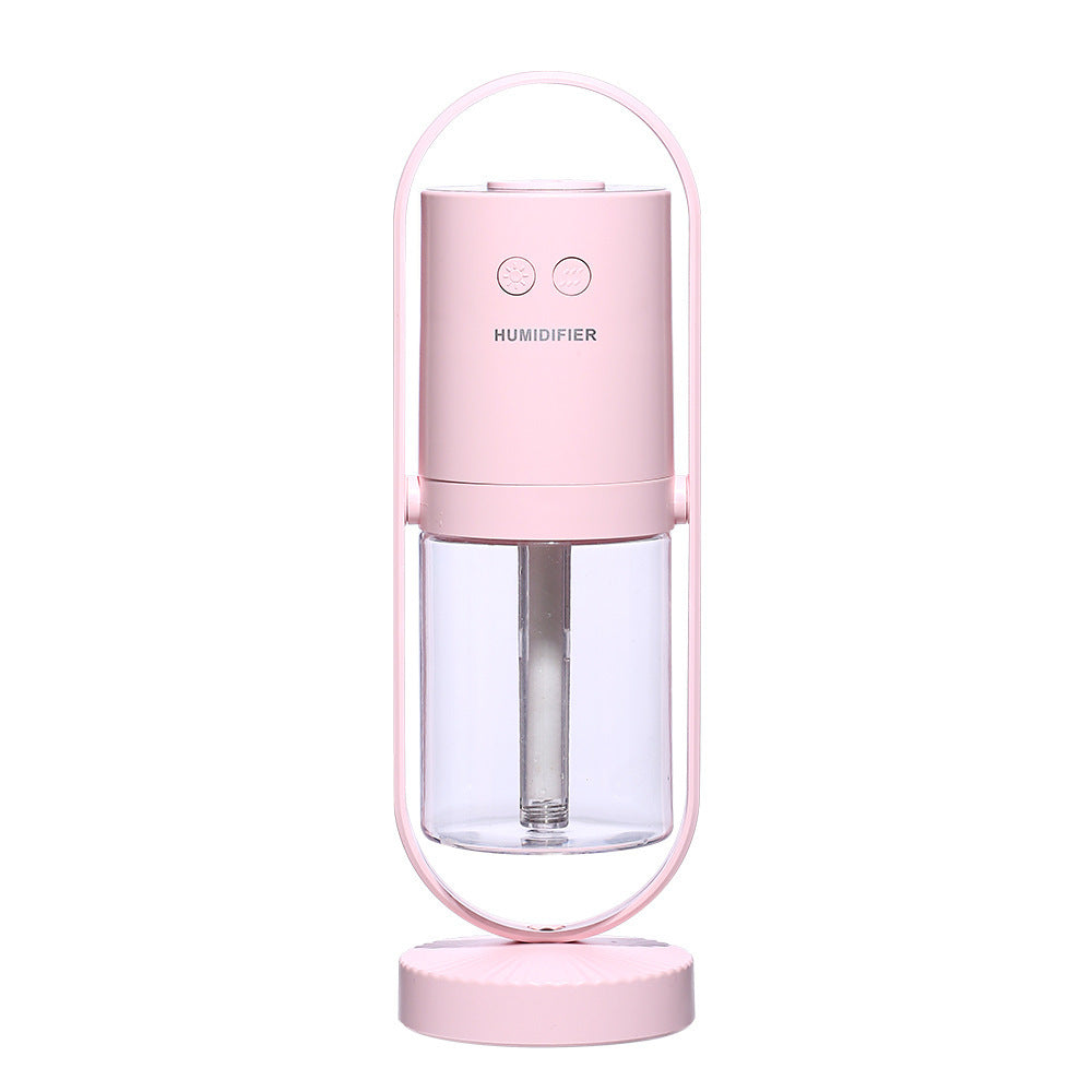Magic Shadow air humidifier in pink color producing cool mist with soft ambient night light (Color: Pink)