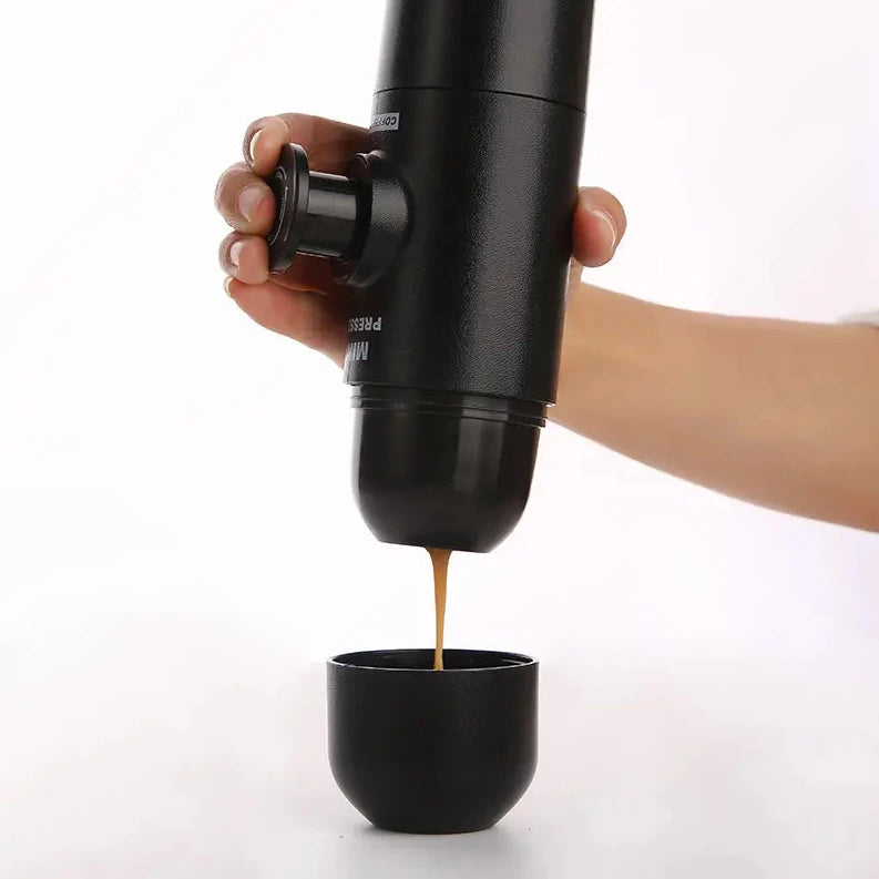 Portable espresso maker compact manual coffee maker for travel camping and office depiction of press and coffee making