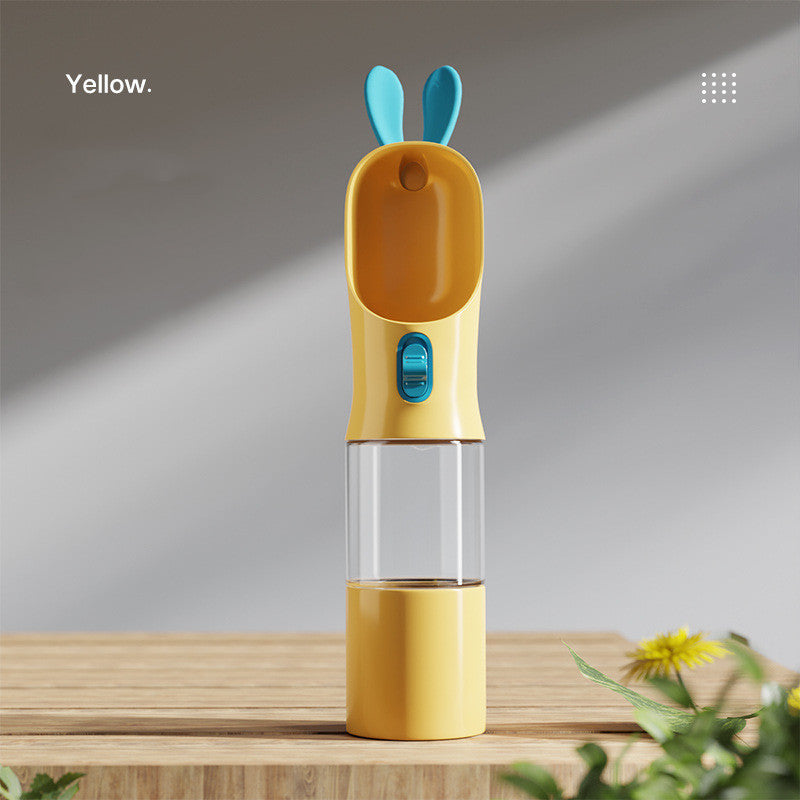 Portable pet water bottle with built-in food container designed for convenient travel and outdoor walks with cats and dogs in yellow color (Color: Yellow)