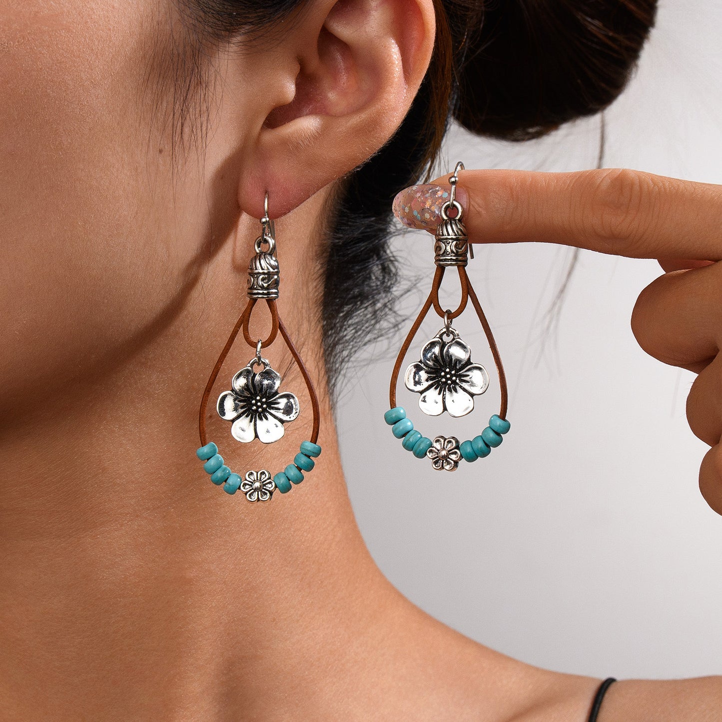 Vintage flower silver earrings with elegant floral design and lightweight everyday wear style model shot
