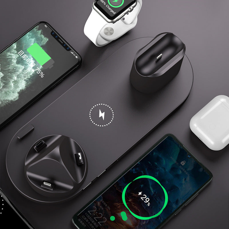 6-in-1 wireless charging dock charging an iPhone, iPad, and Apple Watch simultaneously on a compact desktop charging station birds eye view
