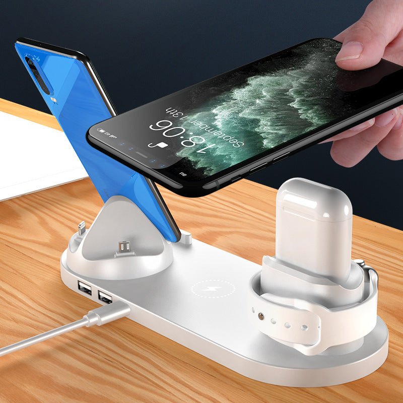 6-in-1 wireless charging dock charging an iPhone, iPad, and Apple Watch simultaneously on a compact desktop charging station in motion