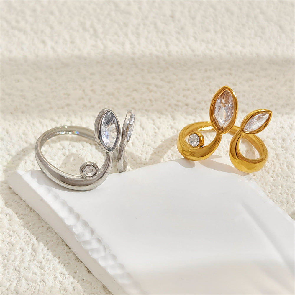 Adjustable stainless steel ring with a gold-plated finish, featuring a modern geometric design and open adjustable fit