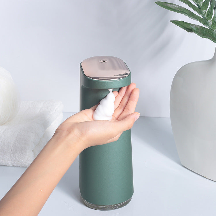 Automatic foam soap dispenser with touch free infrared sensing and rechargeable waterproof design depiction of use