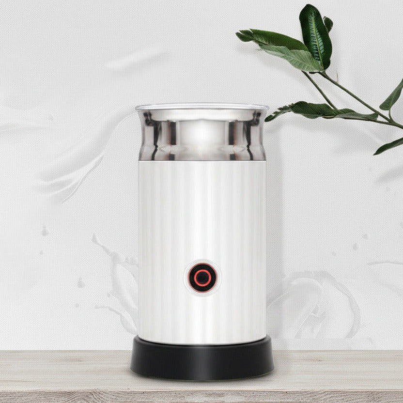 Automatic milk frother and heater on a kitchen counter