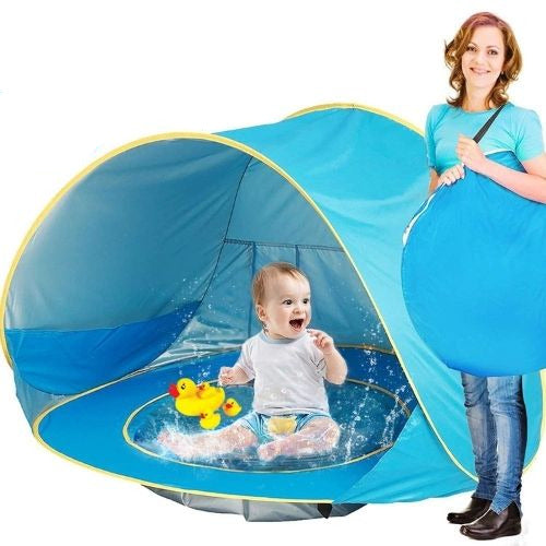 Baby beach tent with pop up design and mini splash pool for outdoor play and sun protection model shot
