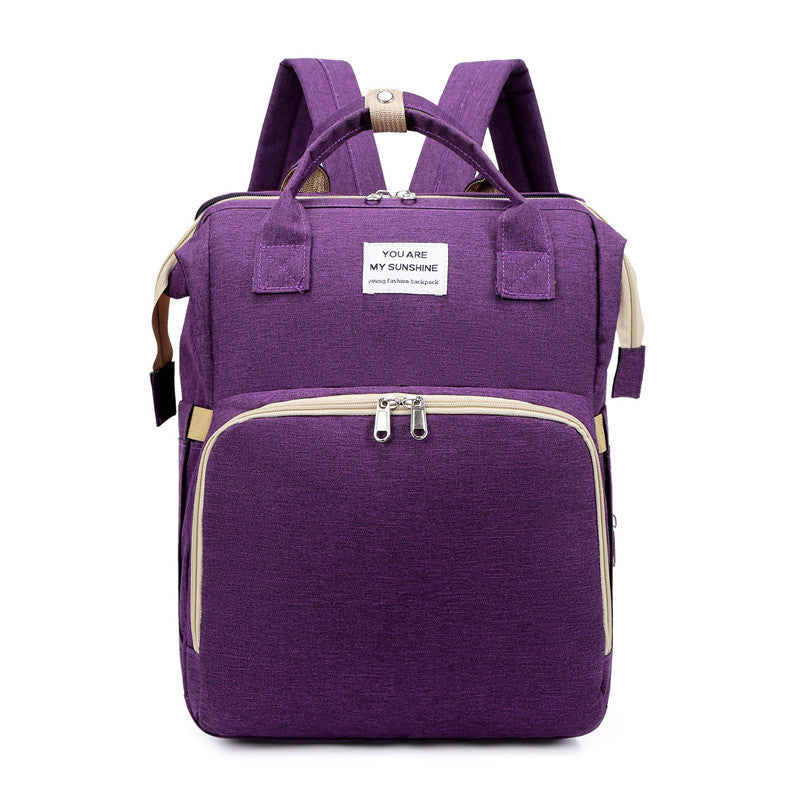 Baby diaper change backpack in purple color with organized storage pockets cushioned straps and portable changing design (Color: Purple)