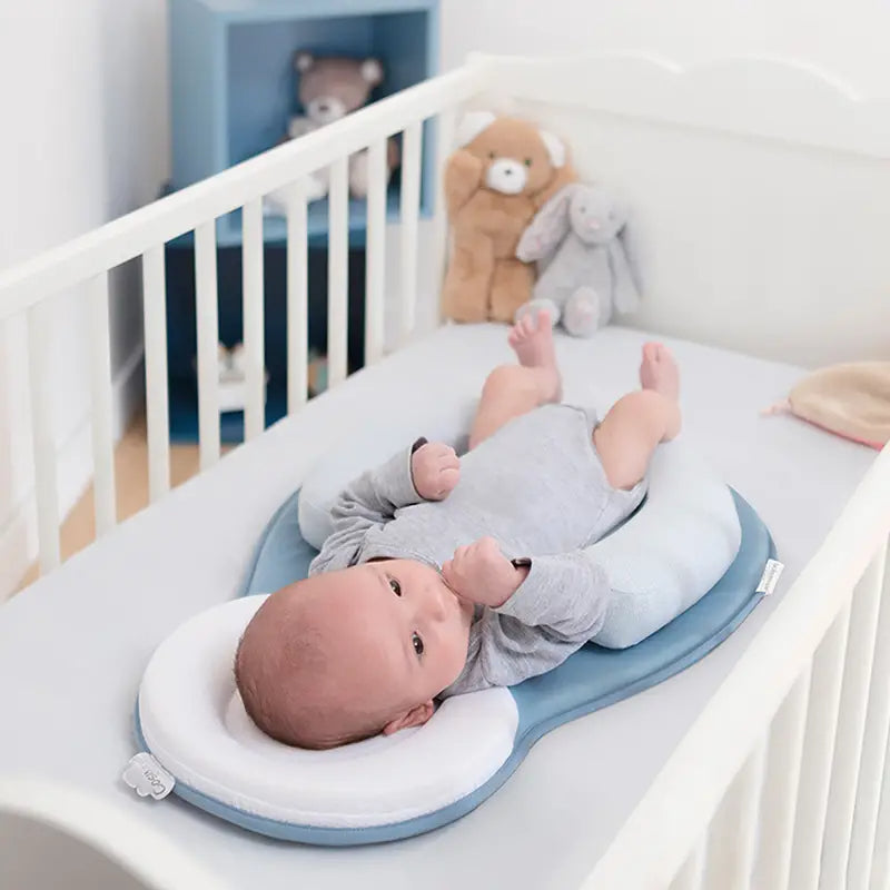 Soft baby head support pillow with anti-roll design, breathable hypoallergenic fabric, and ergonomic neck support for safe infant sleep alternate baby model shot