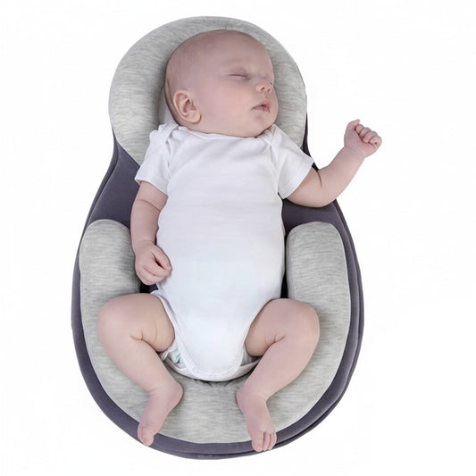 Soft baby head support pillow with anti-roll design, breathable hypoallergenic fabric, and ergonomic neck support for safe infant sleep baby model shot