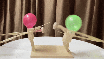 Balloon fencing game with wooden fighters and inflatable balloon heads for fun 2 player battles playtime gif