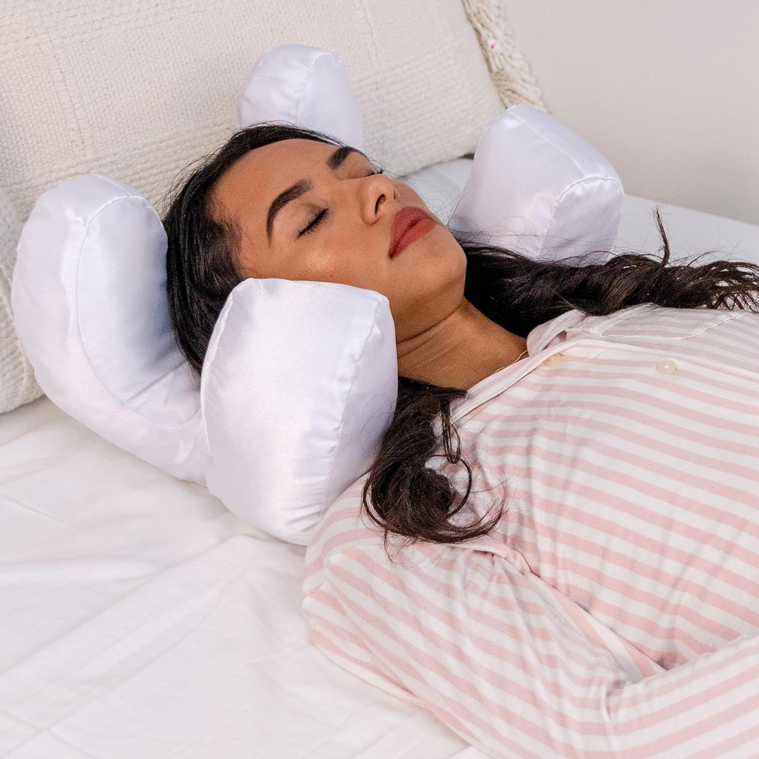 Beauty sleep pillow designed to help reduce facial pressure during sleep and support comfortable resting positions model shot