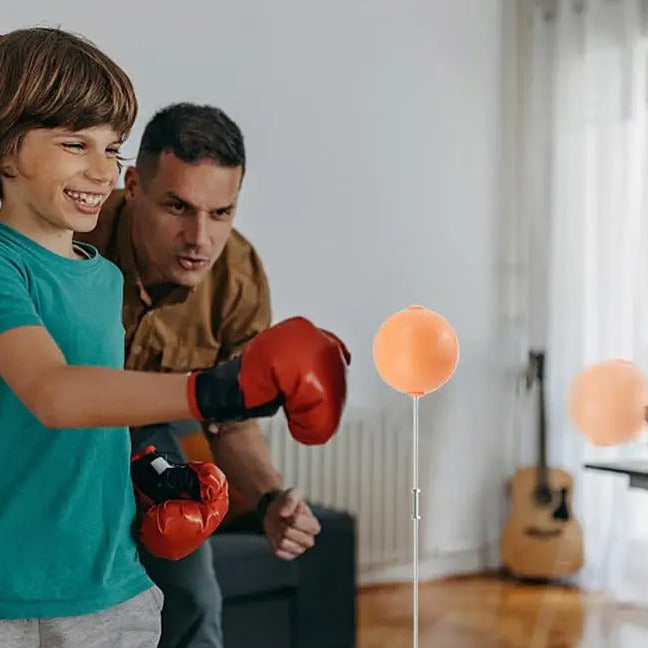 Boxing reflex punching bag with adjustable stand for speed coordination and home training depiction of at home training