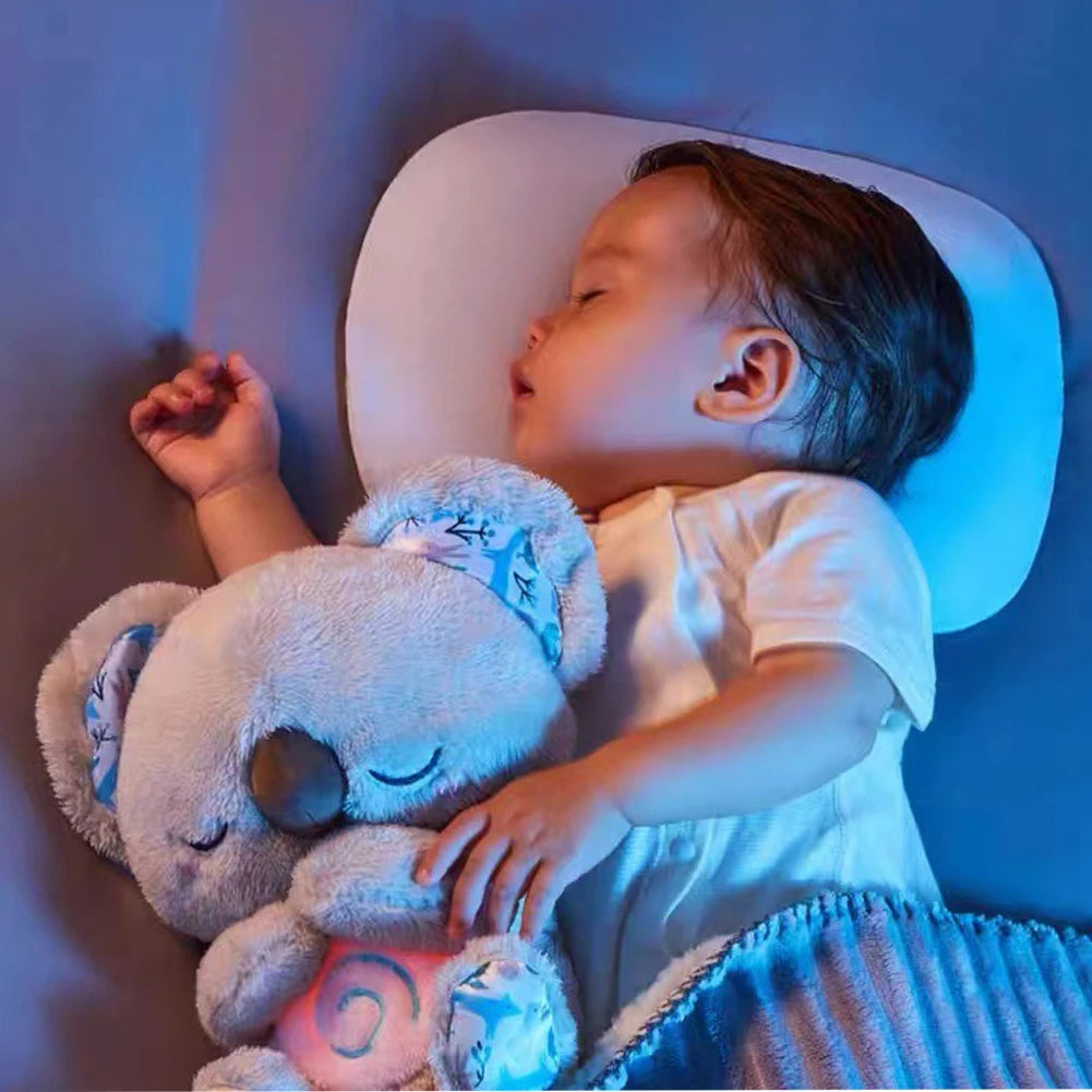 Breathing koala plush toy with calming lights and soothing motion for relaxation and sleep with baby model shot