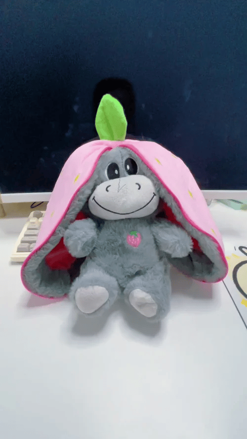 Calming donkey plush toy with breathing motion soothing lights and strawberry and avocado themed designs for bedtime comfort gif