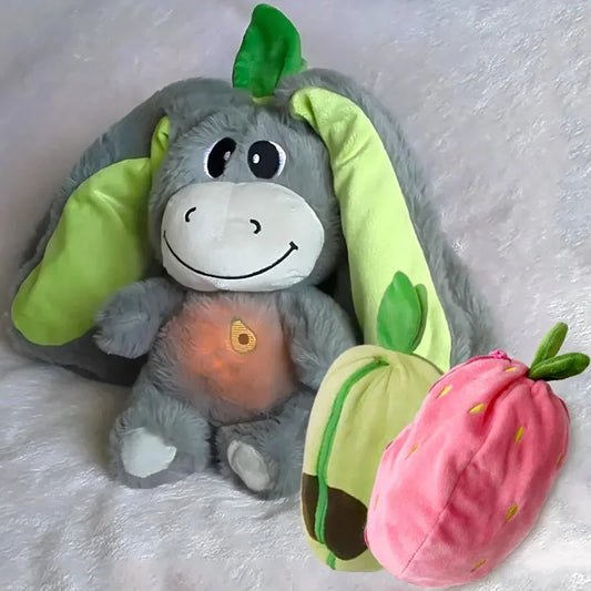 Calming donkey plush toy with breathing motion soothing lights and strawberry and avocado themed designs for bedtime comfort