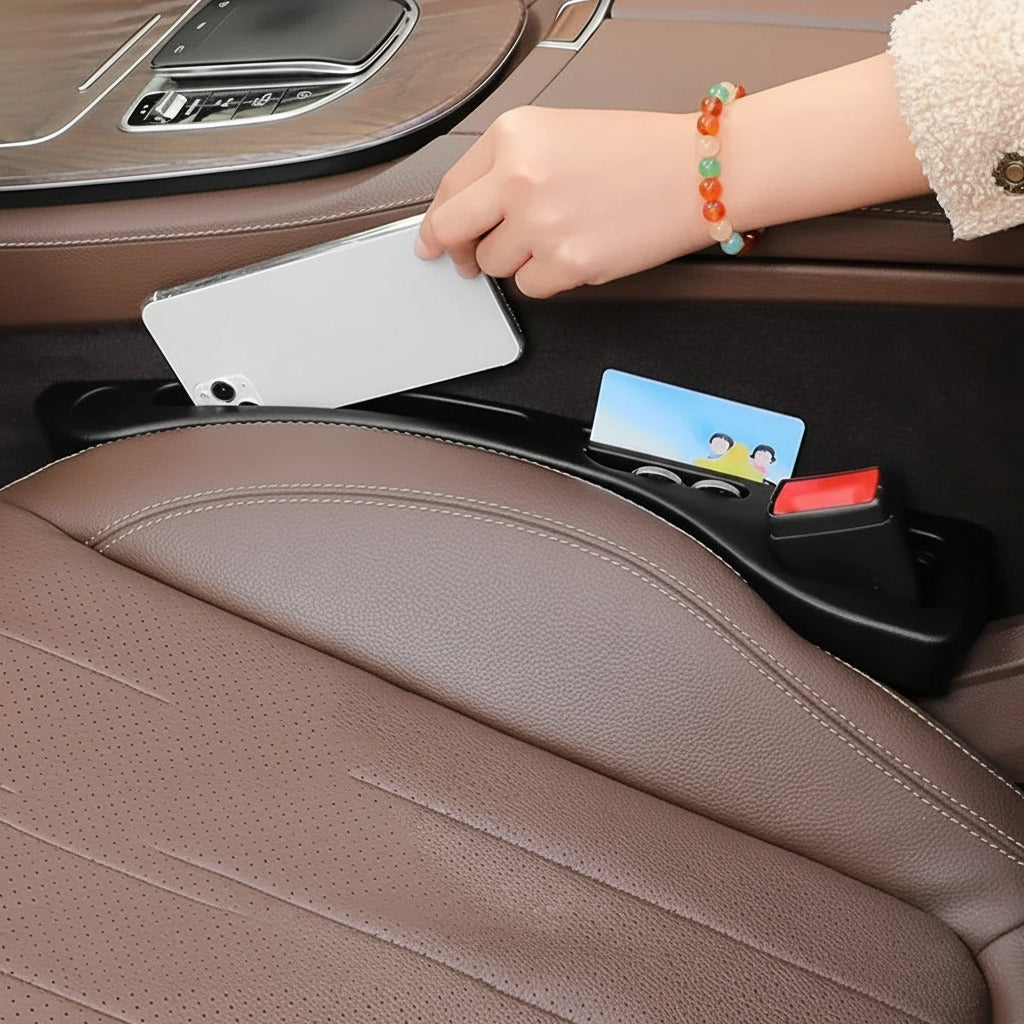 Car seat gap filler insert that prevents phones, keys, and small items from falling between car seats depiction of storage function