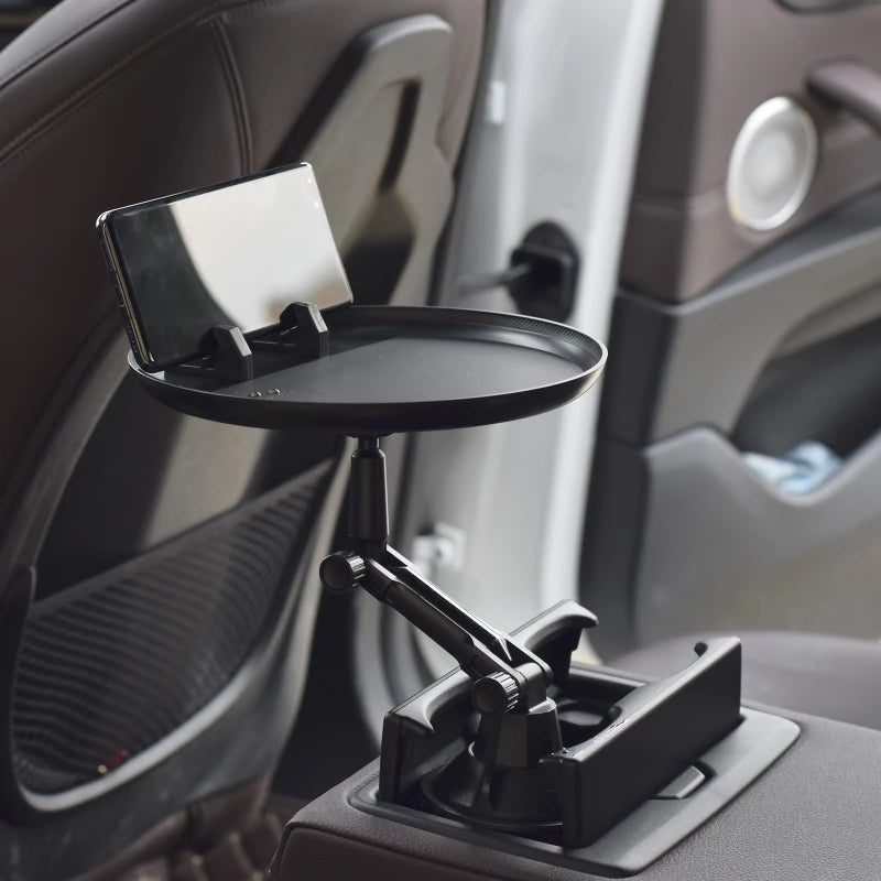Car rotating tray table for eating and holding drinks with 360 degree rotation depiction of use in back seat of a car