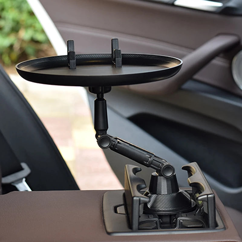 Car rotating tray table for eating and holding drinks with 360 degree rotation depiction of use in front seat of a car