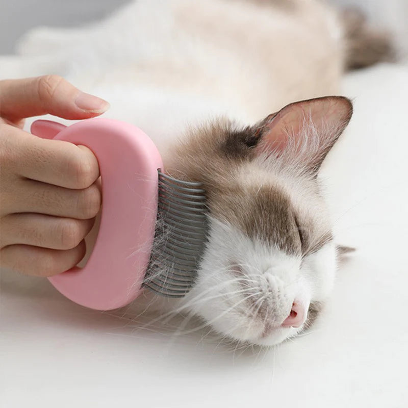 Cat grooming and massage comb for removing tangles loose hair and providing gentle massage depiction of use on a cat