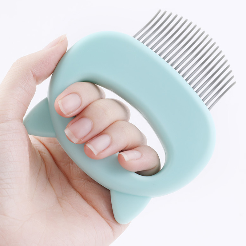 Cat grooming and massage comb for removing tangles loose hair and providing gentle massage depiction of nonslip easy grip handle