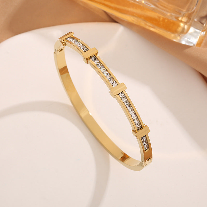 Double layer bracelet in gold color with zircon stones and elegant layered design for everyday wear (Color: Gold)