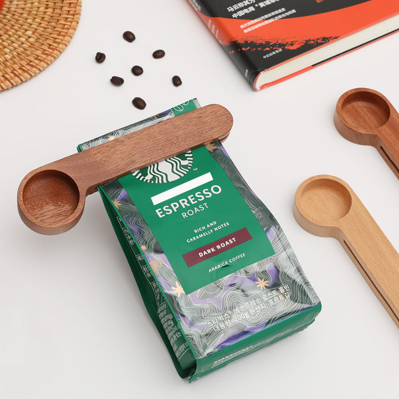 Dual-purpose wooden measuring spoon and sealing clip in use as a sealing clip