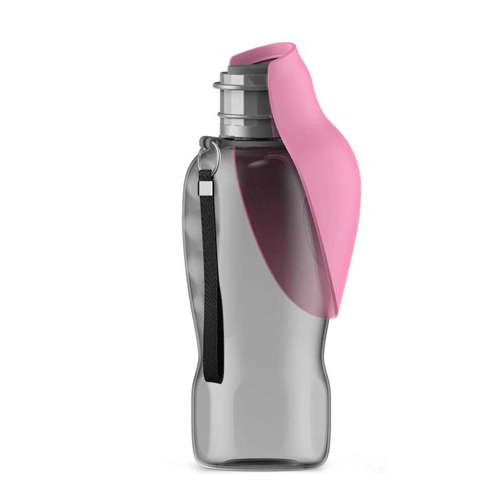 Portable dog water bottle in pink color with built-in bowl and one-button dispenser for outdoor hydration depiction of use (Color: Pink)