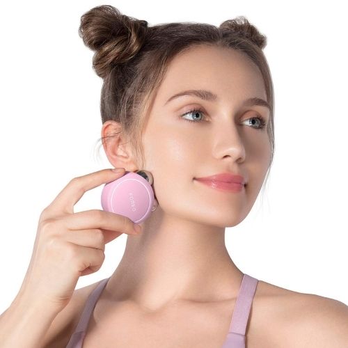 Facial lifting microcurrent device for skin contouring collagen support and rejuvenation model shot