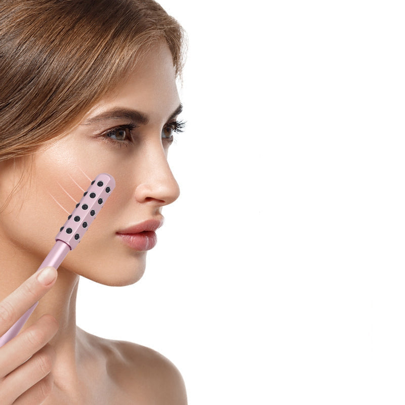 Germanium facial roller massage tool for improving skin tone and reducing puffiness model shot