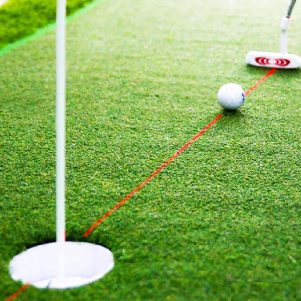 Golf putting alignment laser trainer that attaches to club for improved aim and swing depiction of use