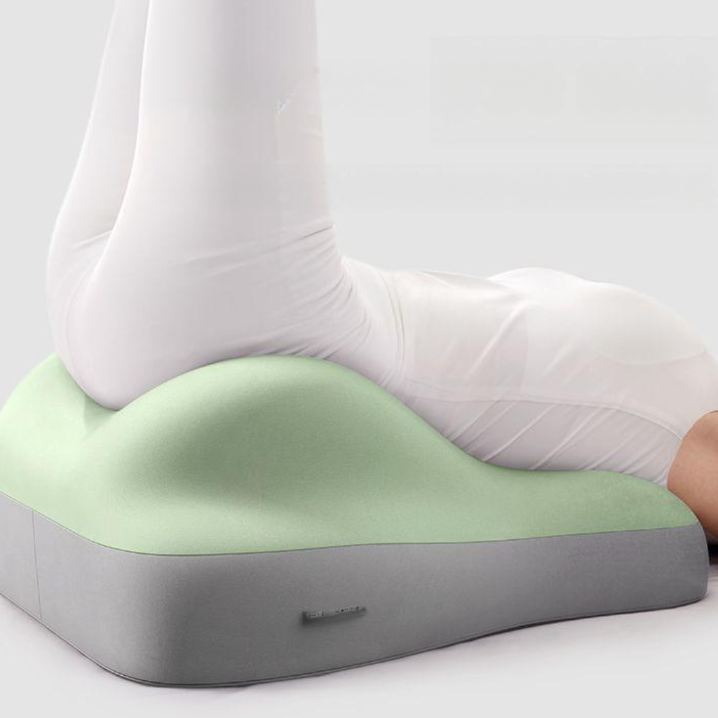 Hip raised bedside sleep cushion made with memory foam for comfortable leg and hip support while resting model shot hips raised alternate angle