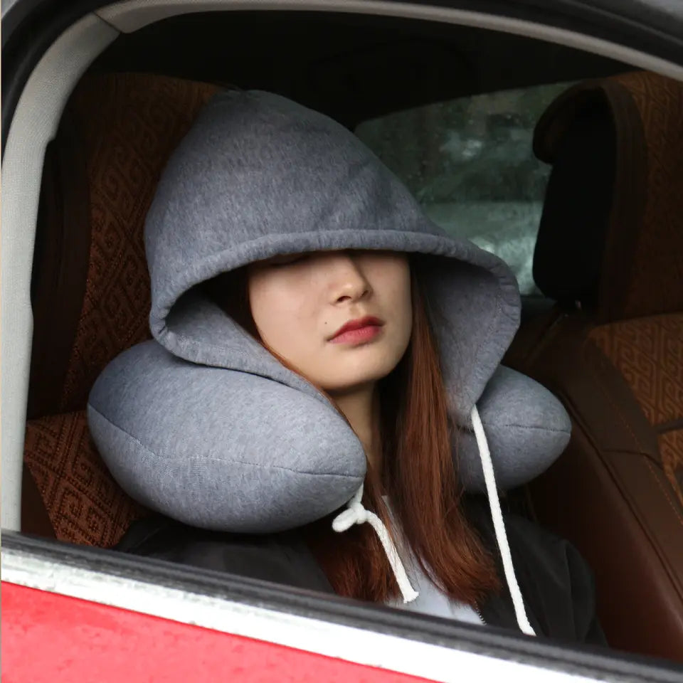 Hooded travel neck pillow with memory foam for comfortable sleep on flights and trips model shot