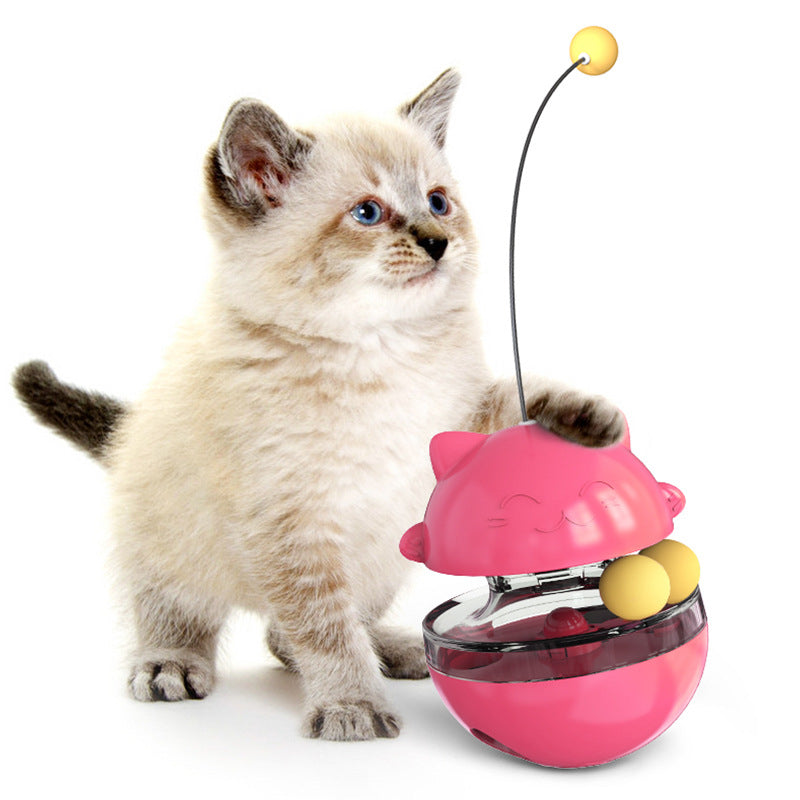 Interactive cat treat ball toy in pink color that dispenses food for play and mental stimulation (Color: Pink)