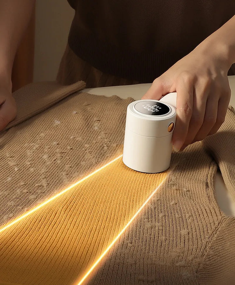 JOYROOM rechargeable lint remover and fabric trimmer with digital display for removing fuzz from clothing depiction of use