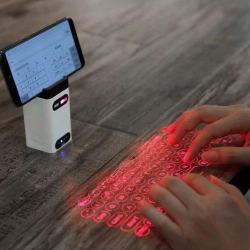 Laser keyboard with virtual projection typing and bluetooth connectivity for portable productivity depiction of use