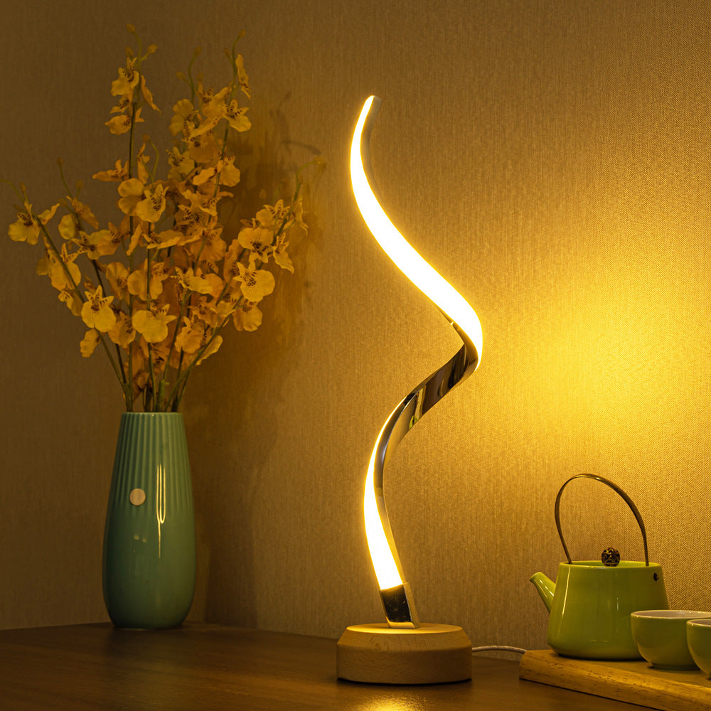 LED spiral table lamp with modern curved design and dimmable warm light