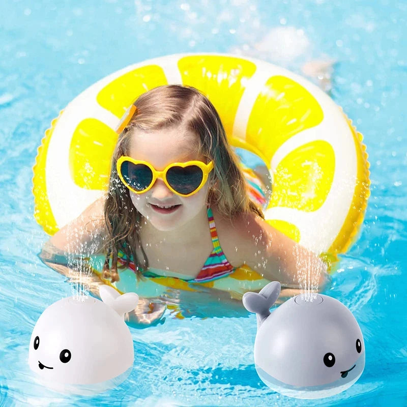 Light up whale bath toy with rechargeable battery colorful lights and water fountain spray for toddlers model shot