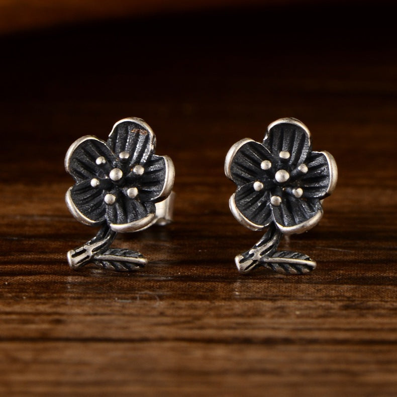 Lotus silver stud earrings with minimalist floral design for everyday wear