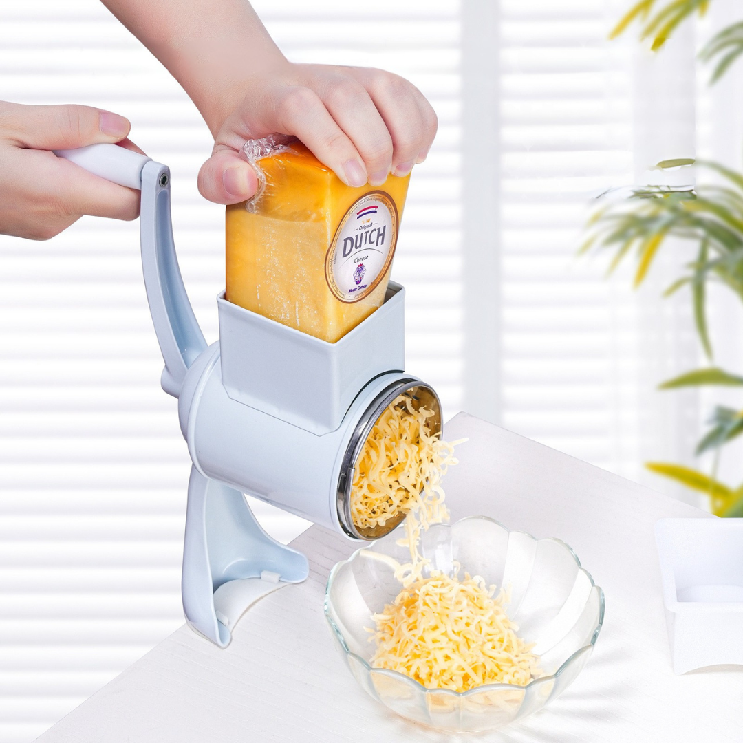 Manual cheese and nut grinder with hand crank and stainless steel blades depiction of cheese grating