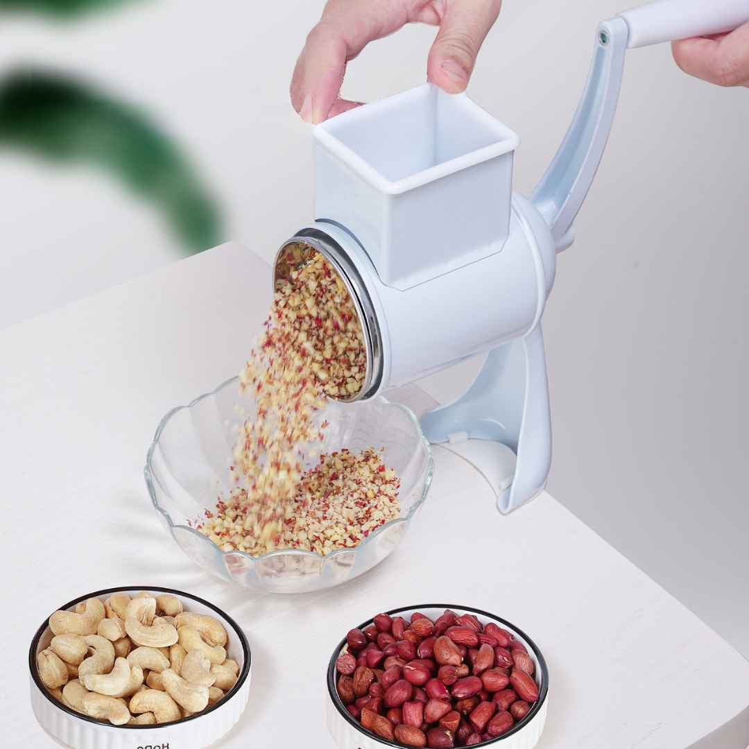 Manual cheese and nut grinder with hand crank and stainless steel blades depiction of nut grinding