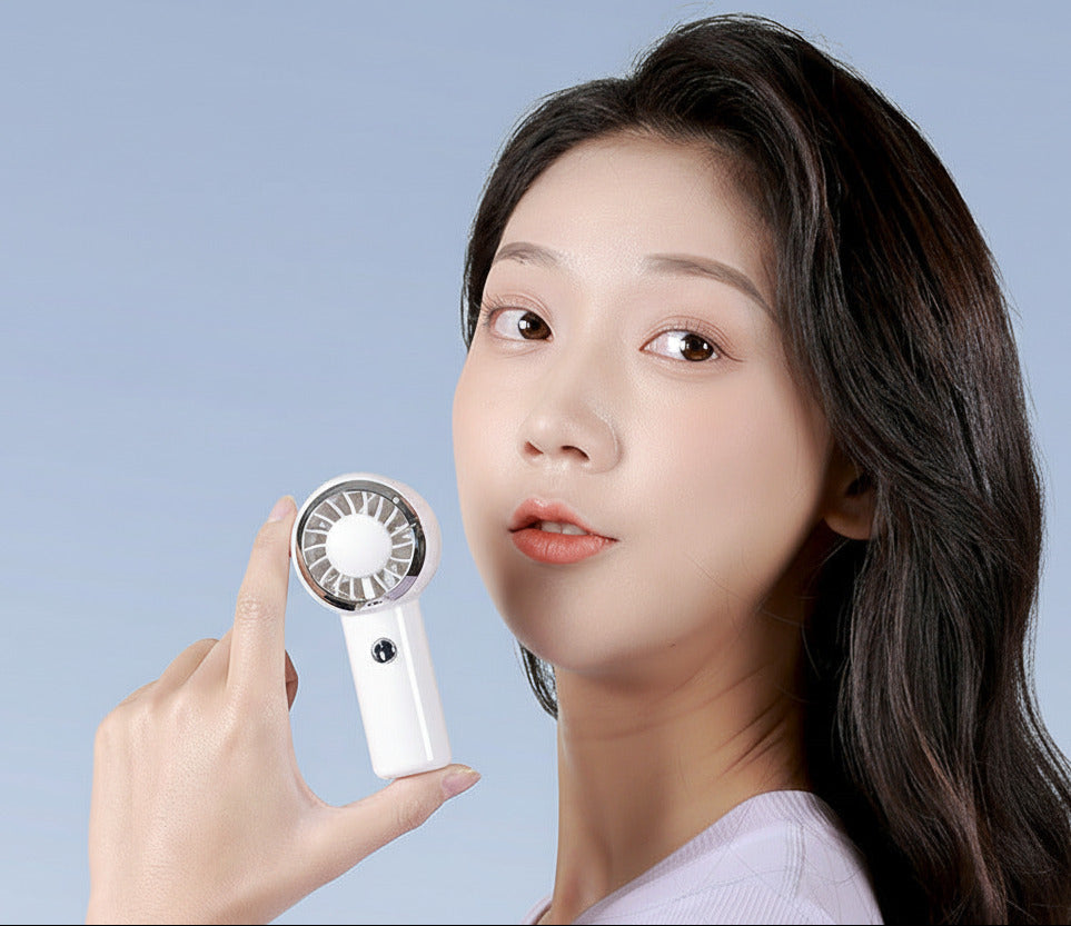 Mini portable turbo fan with USB rechargeable design for compact personal cooling on the go depiction of product shot with the model