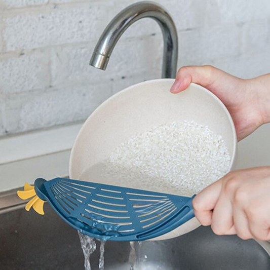 Multifunctional kitchen strainer for draining pasta rice and vegetables compact and easy to use depiction of use as a clip-on pot strainer