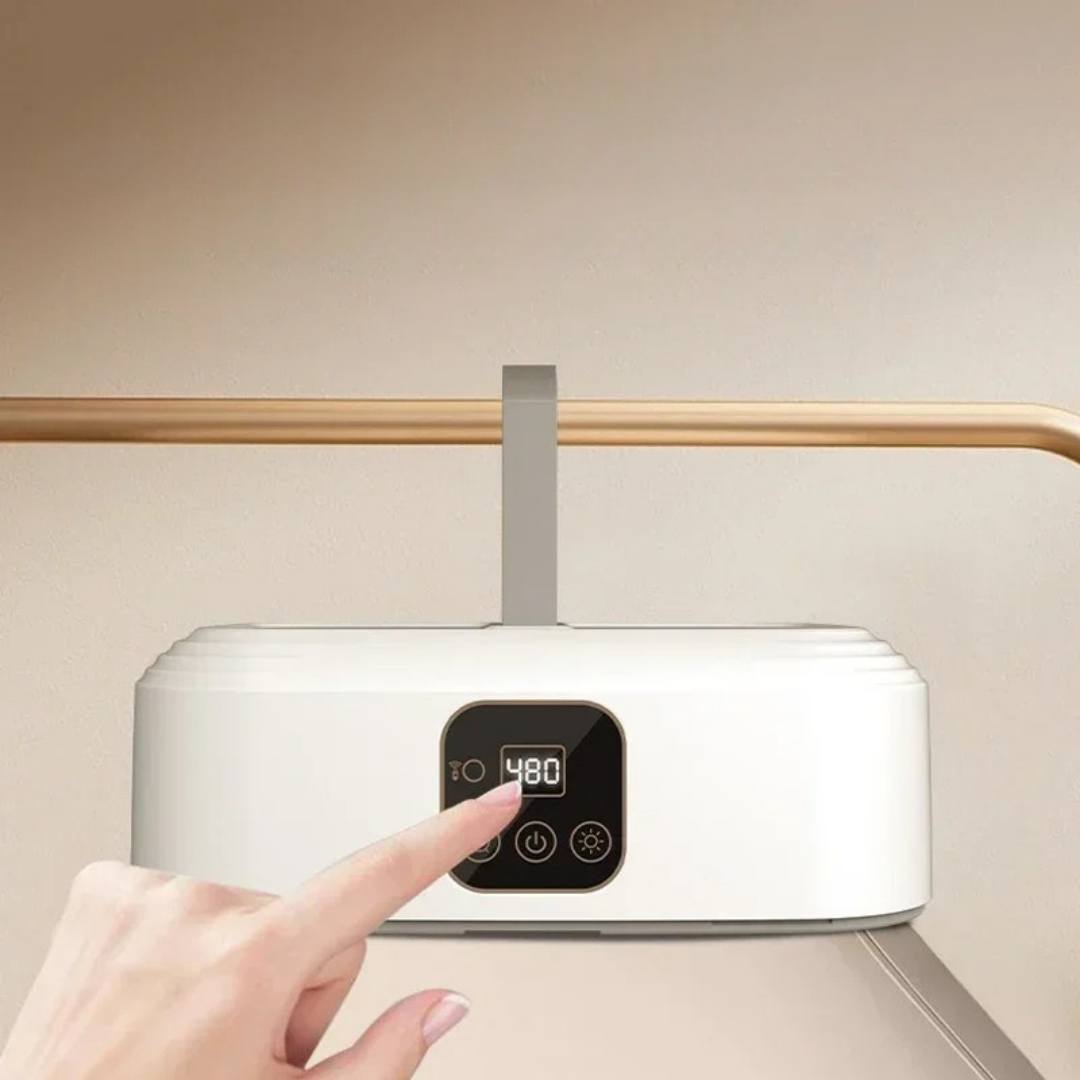 Portable clothes dryer compact foldable drying solution for travel and small spaces depiction of switching the device on