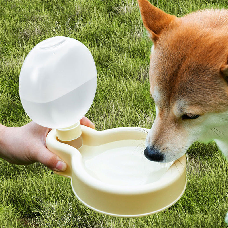 Portable pet water bottle with foldable bowl and leak-proof design for dogs and cats travel hydration in use