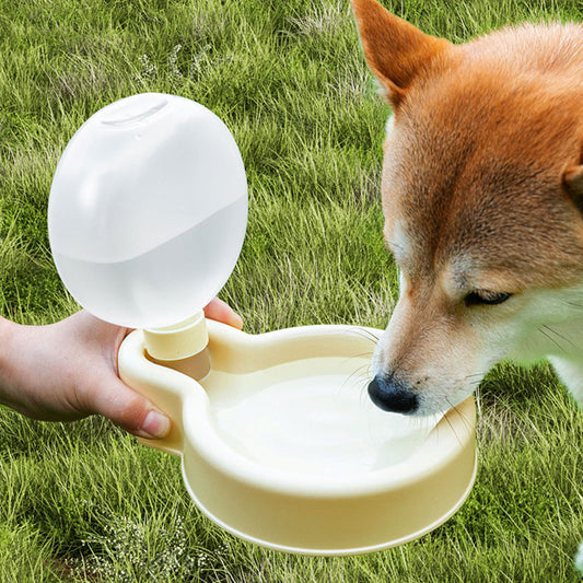 Portable pet water bottle with foldable bowl and leak-proof design for dogs and cats travel hydration in use