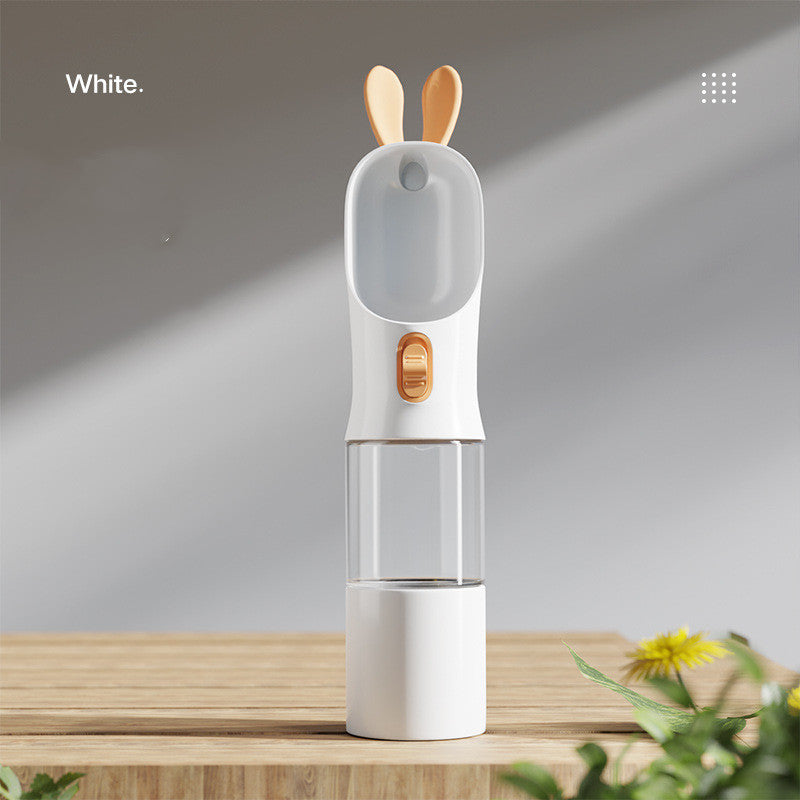 Portable pet water bottle with built-in food container designed for convenient travel and outdoor walks with cats and dogs in white color (Color: White)