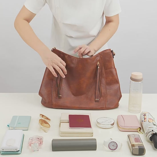 Women’s large capacity shoulder bag in brown color with soft leather look and multiple compartments for everyday use video