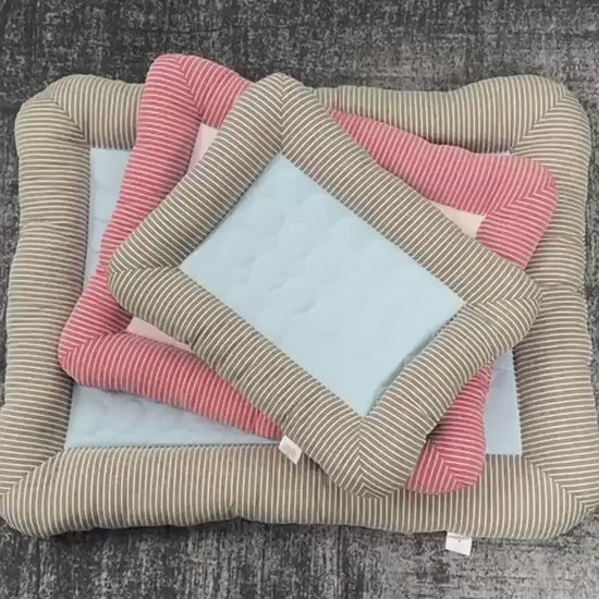 Dog playing on a self-cooling soft and washable sleeping bed mat for pets, cats and dogs